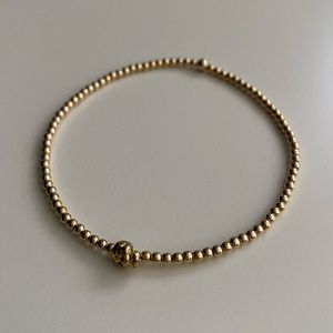 Tiny Skull bead with 2mm Gold beads bracelet